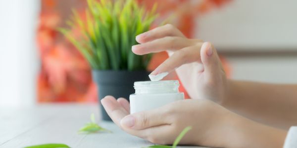 woman holds jar with cosmetic cream her hands 2